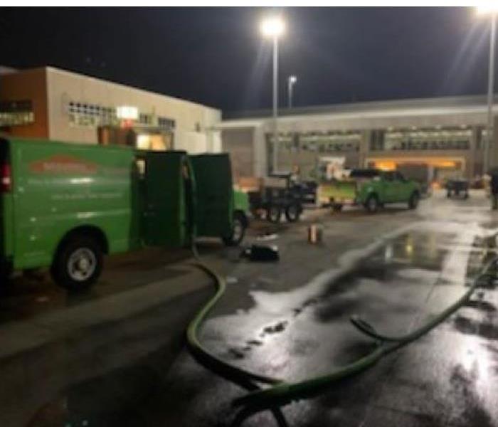 SERVPRO trucks and equipment in front of a commercial building in Cantonment, Florida