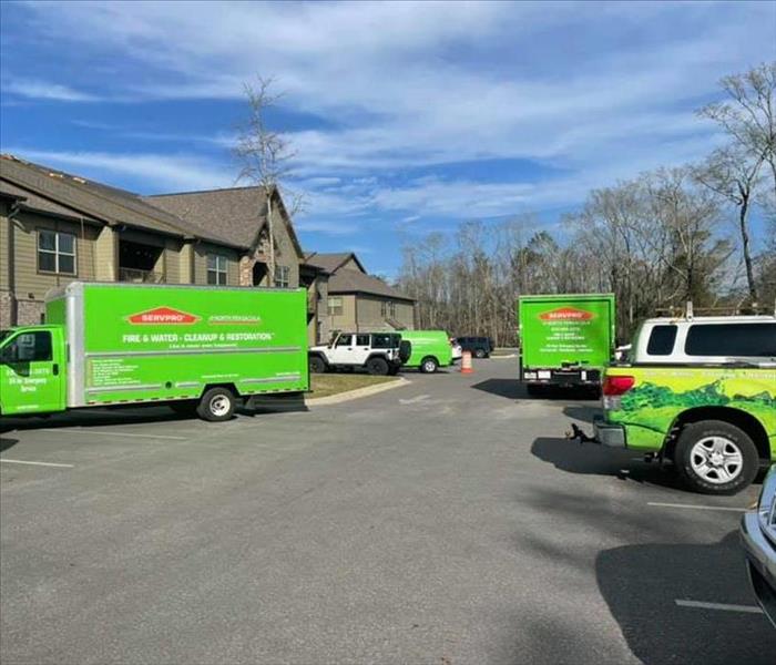 SERVPRO trucks in an apartment complex parking lot in Pensacola.