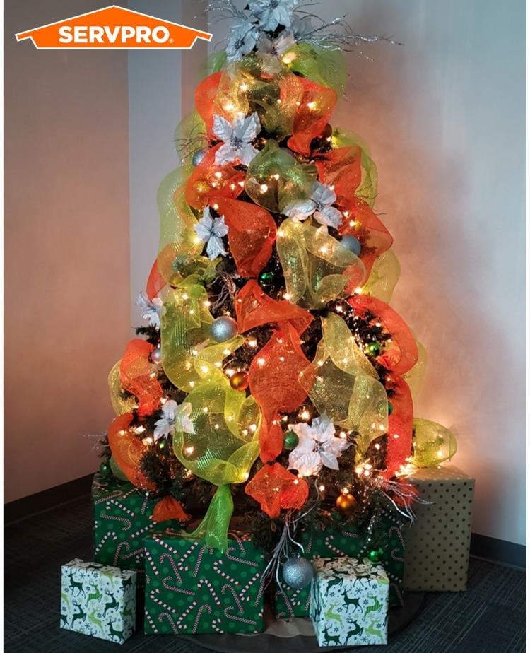 Christmas Tree decorated in SERVPRO colors with SERVPRO logo